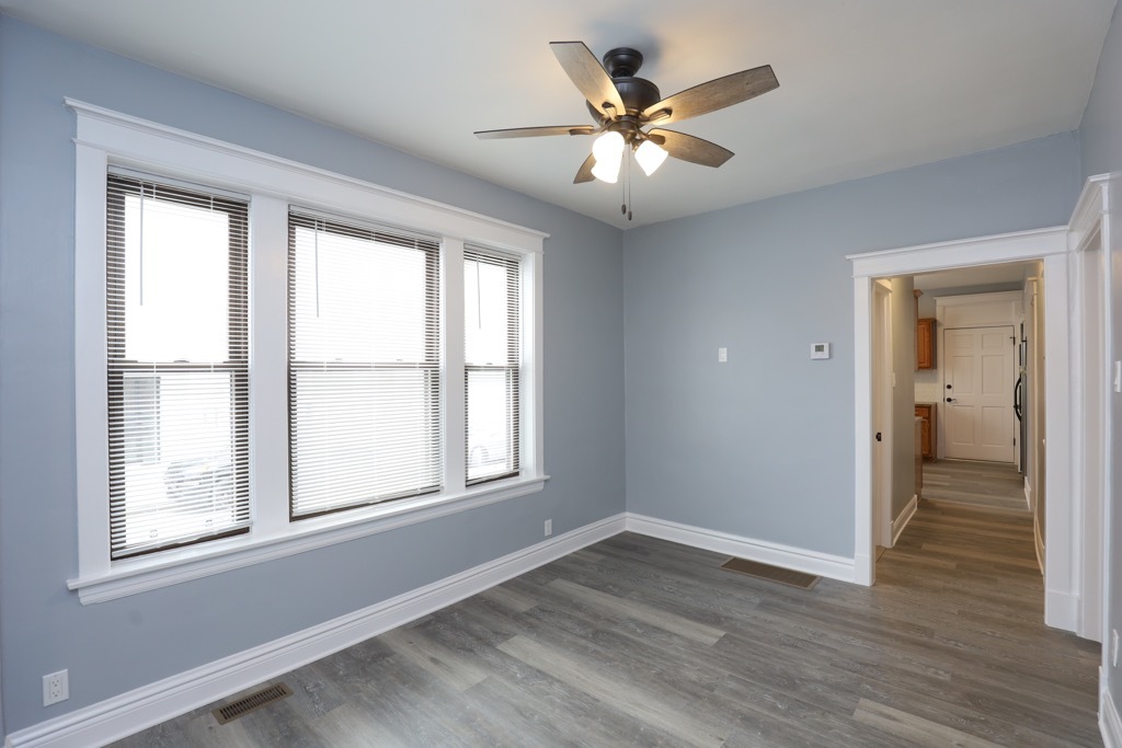 2039 West 23rd Street, Unit 1 Chicago, IL 60608 - Photo 14 of 20 a view of an empty room with wooden floor and a window