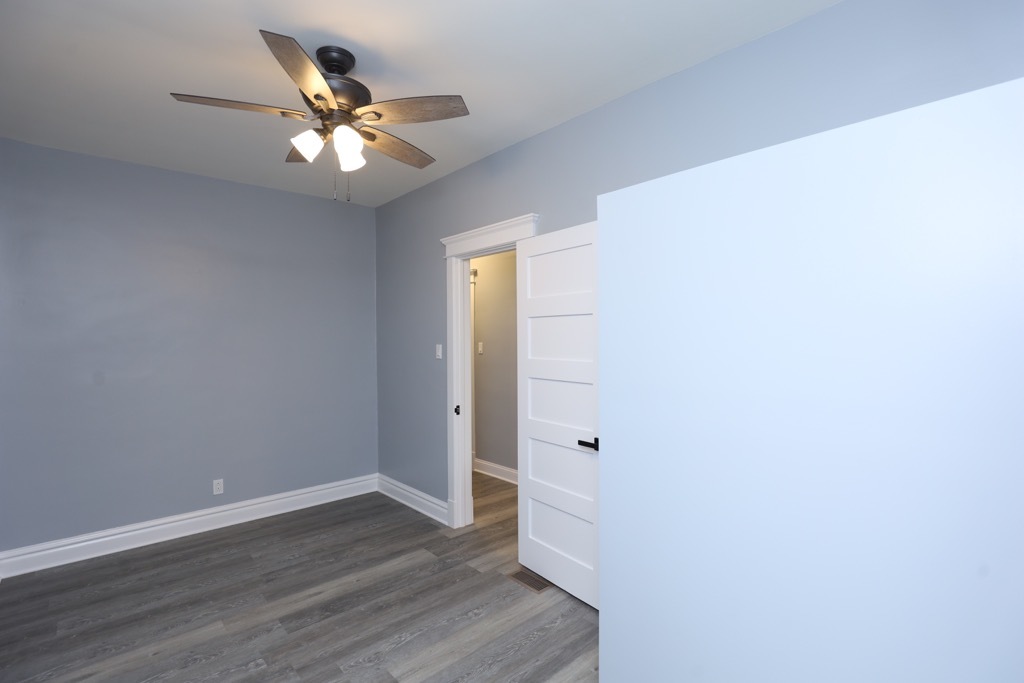 2039 West 23rd Street, Unit 1 Chicago, IL 60608 - Photo 18 of 20 a view of a livingroom with wooden floor and a ceiling fan