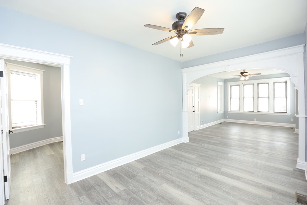 2039 West 23rd Street, Unit 1 Chicago, IL 60608 - Photo 8 of 20 wooden floor in an empty room with a window