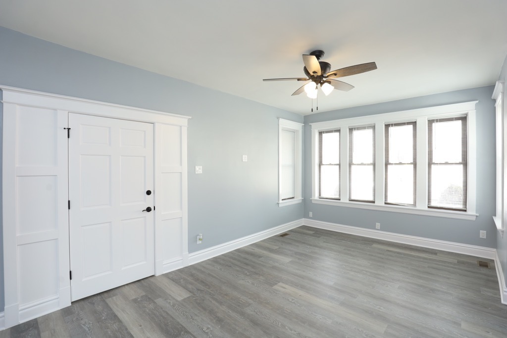 2039 West 23rd Street, Unit 1 Chicago, IL 60608 - Photo 10 of 20 wooden floor in an empty room with a window