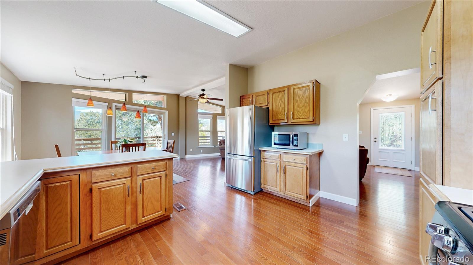53 O'Brien Road Bailey, CO 80421 - Photo 15 of 49 a large kitchen with a lot of counter space and stainless steel appliances