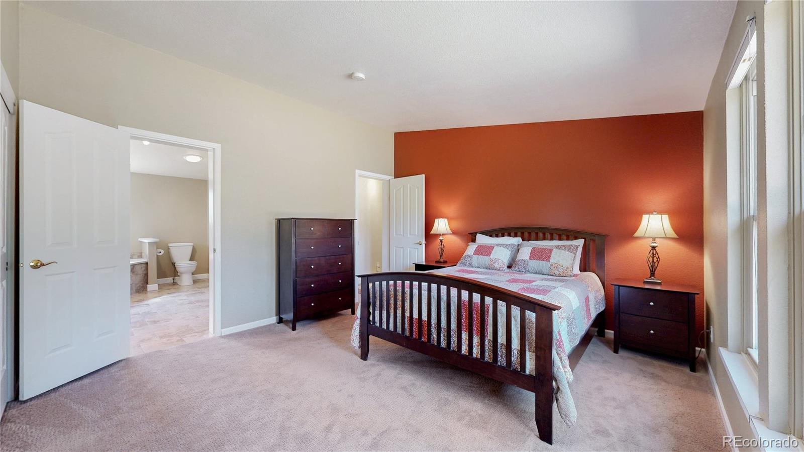 53 O'Brien Road Bailey, CO 80421 - Photo 23 of 49 a bedroom with a bed and a lamp