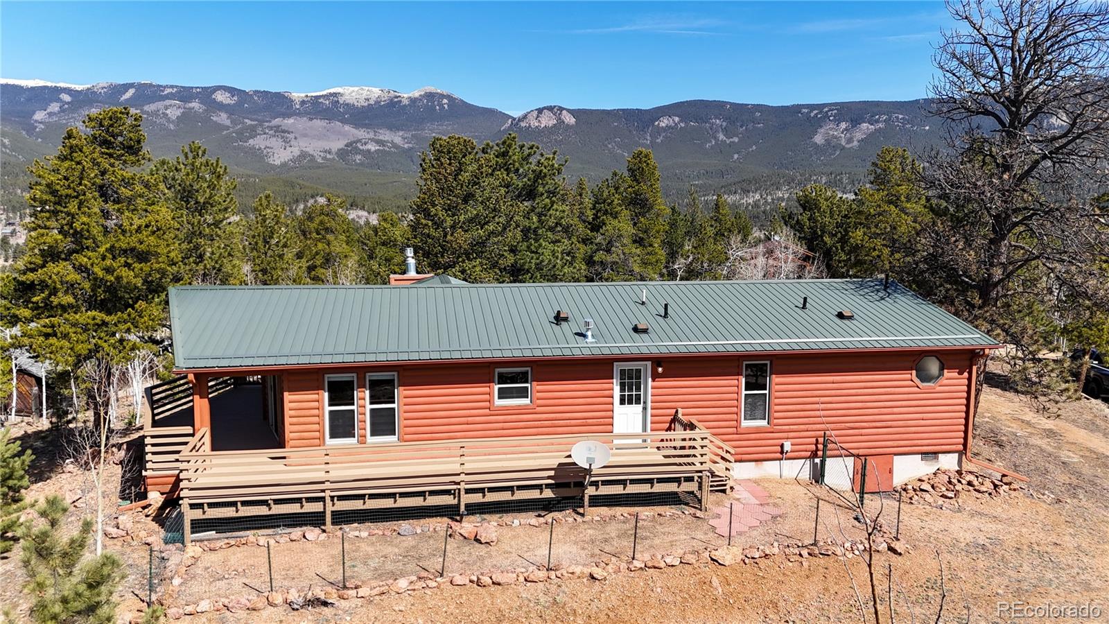 53 O'Brien Road Bailey, CO 80421 - Photo 3 of 49 an aerial view of a house with a yard and mountain view in back