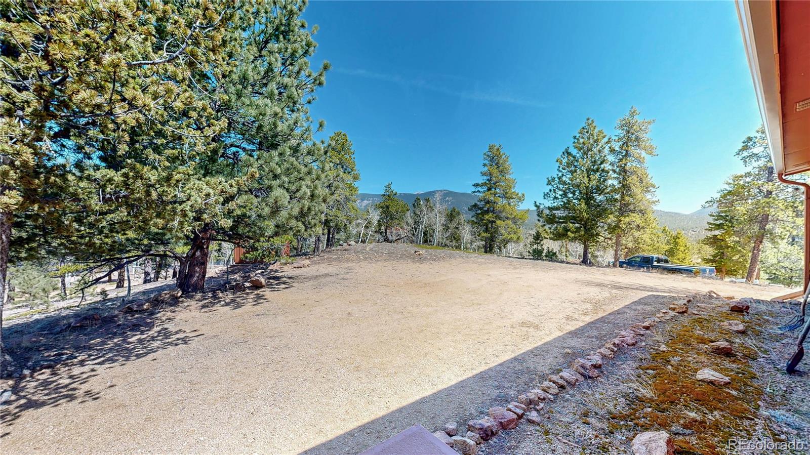 53 O'Brien Road Bailey, CO 80421 - Photo 37 of 49 a view of a backyard of a house