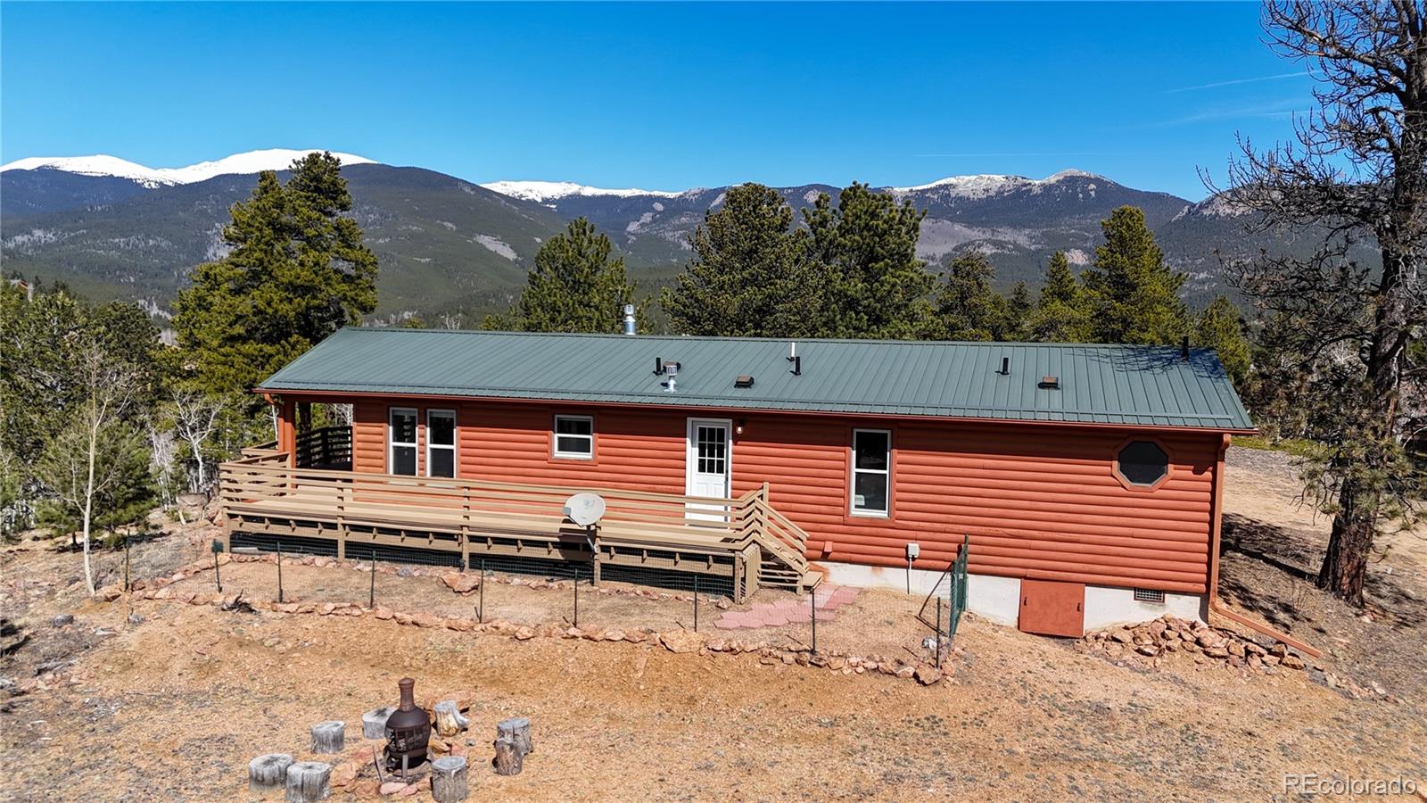 53 O'Brien Road Bailey, CO 80421 - Photo 39 of 49 a view of a house with a yard