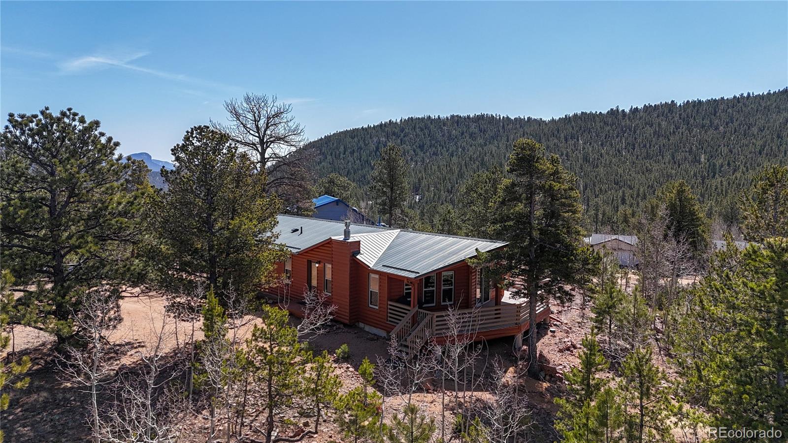 53 O'Brien Road Bailey, CO 80421 - Photo 41 of 49 a house with a tree in the background