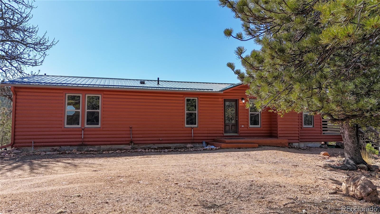 53 O'Brien Road Bailey, CO 80421 - Photo 5 of 49 a front view of a house