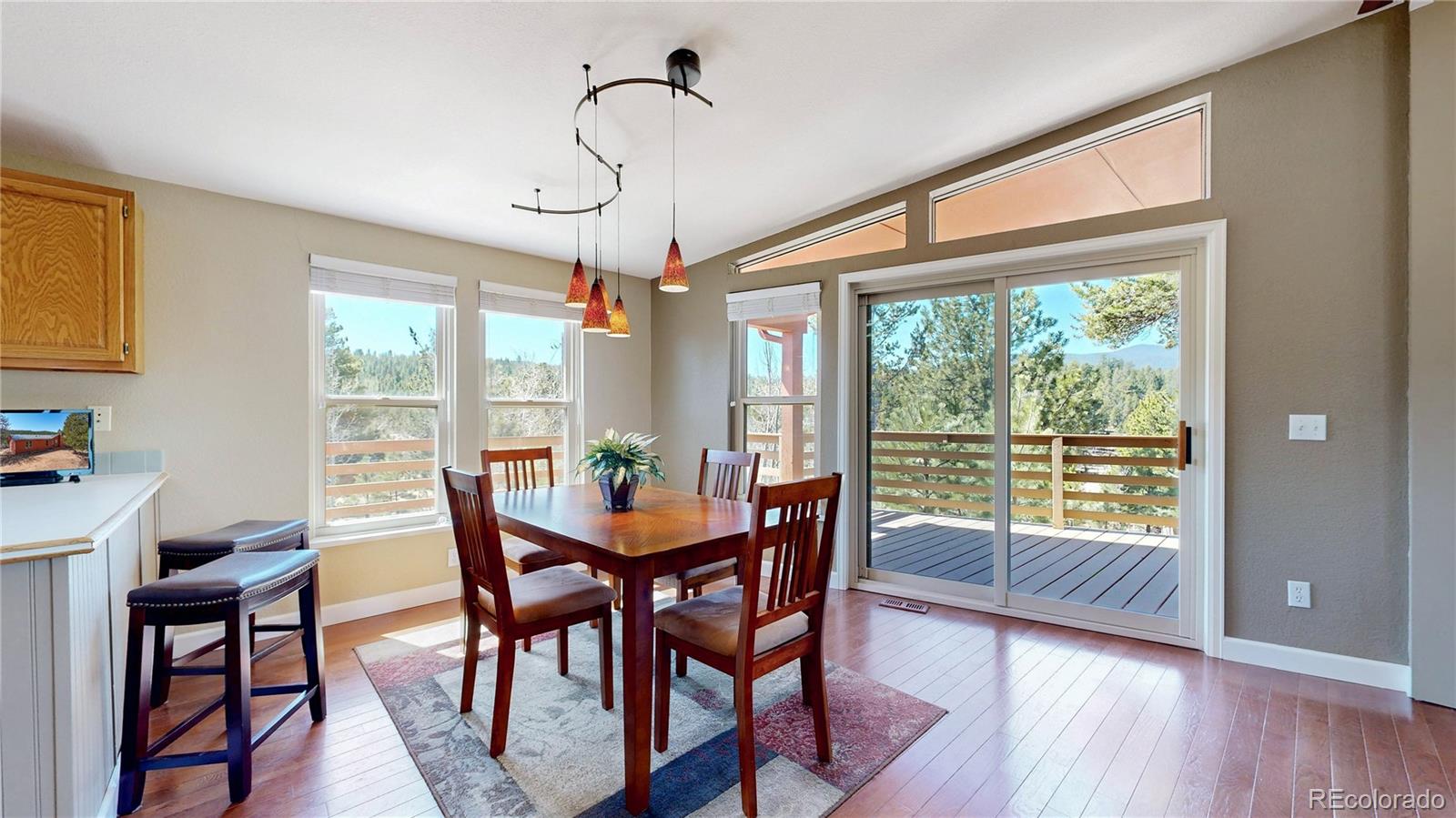 53 O'Brien Road Bailey, CO 80421 - Photo 10 of 49 a view of a dining room with furniture window and wooden floor