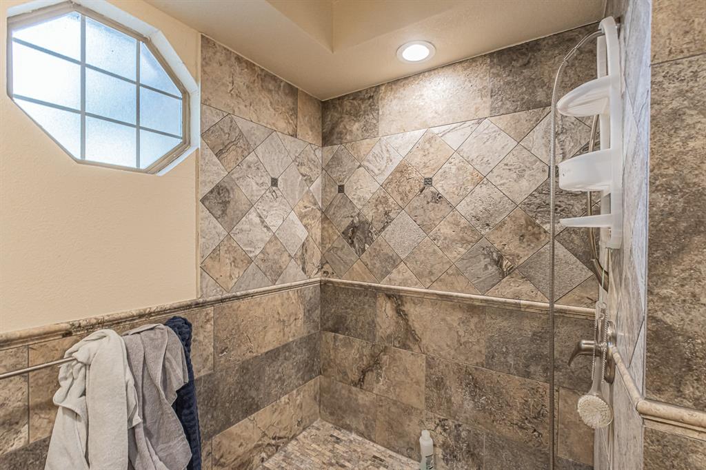 3309 Timber View Circle Bedford, TX 76021 - Photo 17 of 38 a bathroom with a shower and a mirror