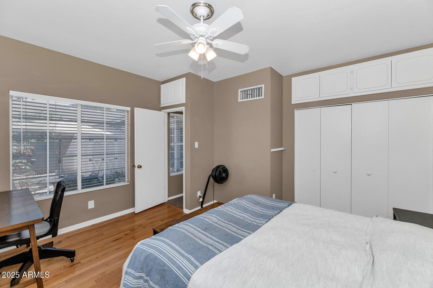 60 East Hoover Avenue Phoenix, AZ 85004 - Photo 15 of 24 a bedroom with a bed window and a table