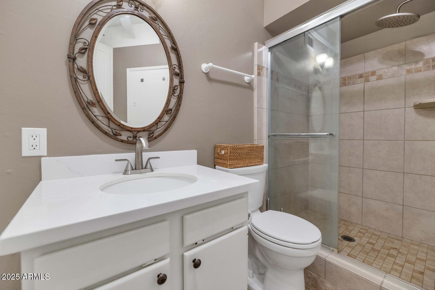60 East Hoover Avenue Phoenix, AZ 85004 - Photo 16 of 24 a bathroom with a sink a toilet and a mirror