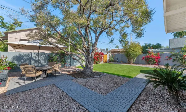 an aerial view of house with yard swimming pool and outdoor seating
