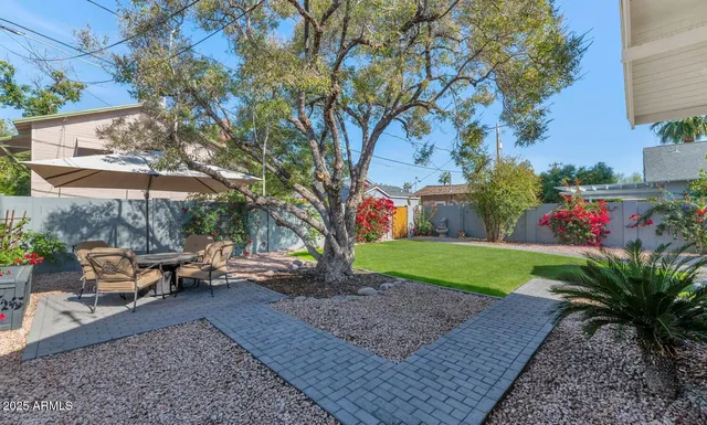 an aerial view of house with yard swimming pool and outdoor seating