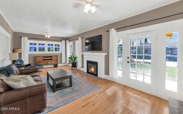 a living room with furniture and a fireplace