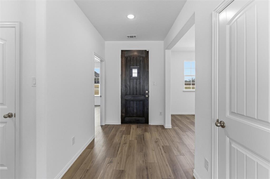 144 Oak Grv Way Springtown, TX 76082 - Photo 7 of 27 wooden floor in an empty room