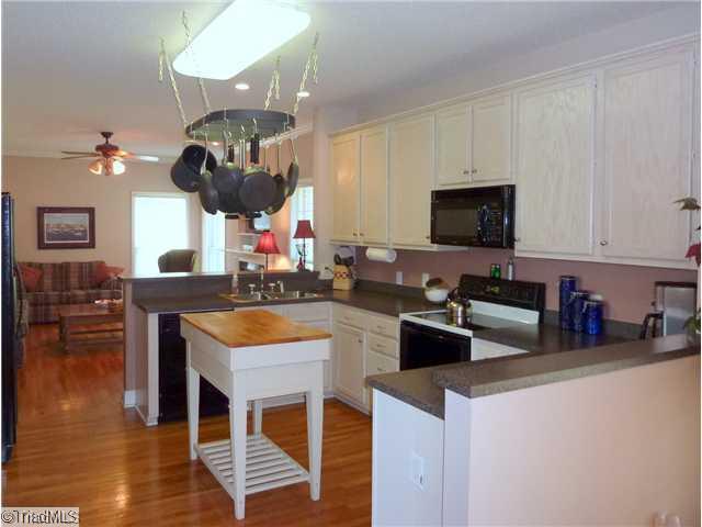 327 Beech Ridge Road Thomasville, NC 27360 - Photo 4 of 13 Kitchen. Hardwoods through out the Kitchen/Den/Breakfast Area. Breakfast area off Kitchen. Built in Microwave,Slide In Range/Oven,Dishwasher Remain
