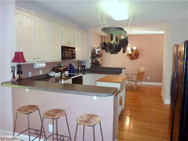 327 Beech Ridge Road Thomasville, NC 27360 - Photo 5 of 13 Kitchen. Another view of Kitchen with bar for morning coffee. View of Breakfast Area as well.
