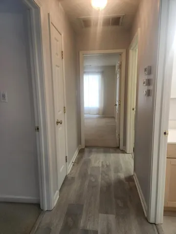 a view of a hallway with some storage area