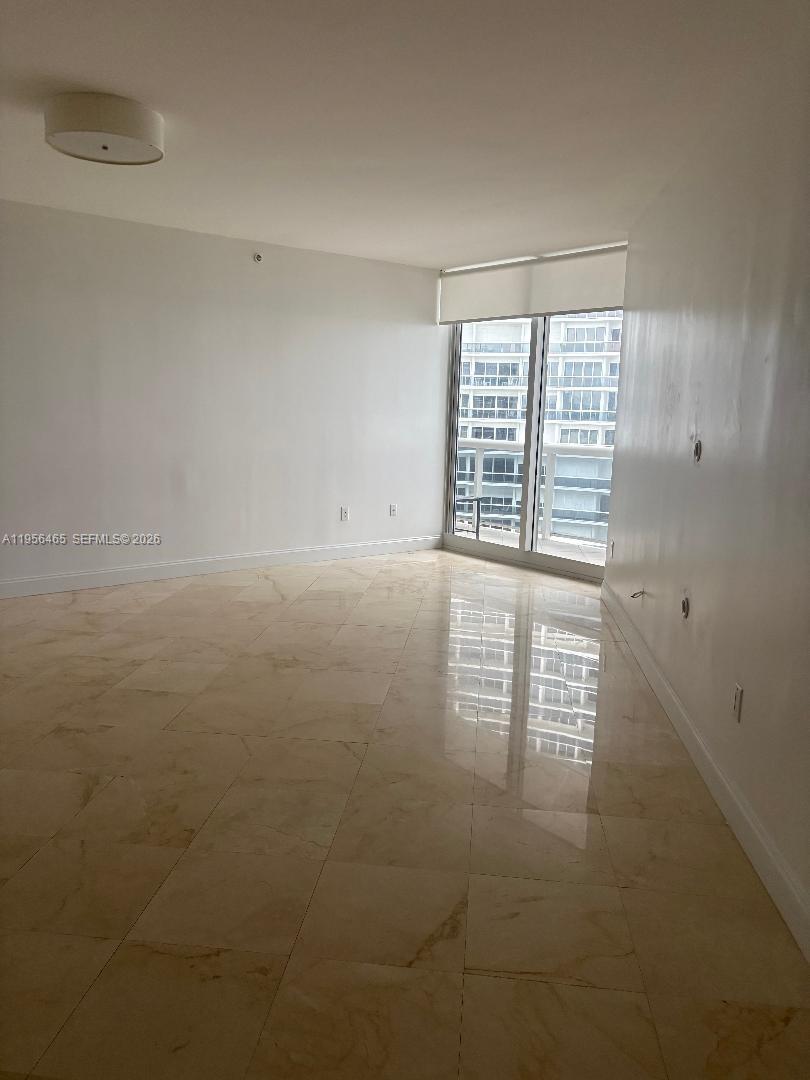 9595 Collins Avenue, Unit N8I Surfside, FL 33154 - Photo 2 of 5 a view of an empty room with a window