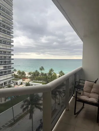 a view of balcony with furniture