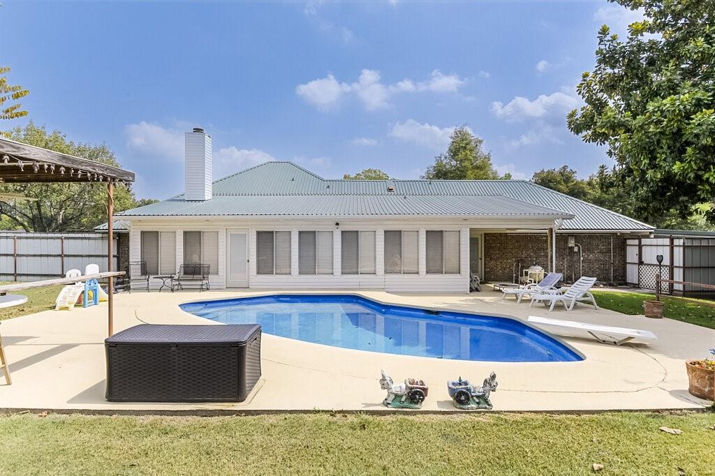a front view of a house with swimming pool