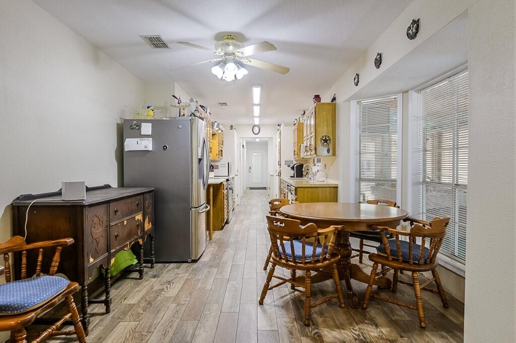 111 Kirk Road Midlothian, TX 76065 - Photo 13 of 40 a view of a dining room with furniture and a chandelier