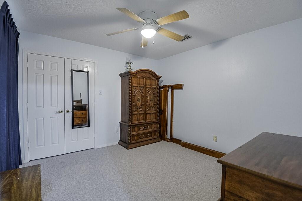 111 Kirk Road Midlothian, TX 76065 - Photo 18 of 40 an empty room with closet and windows
