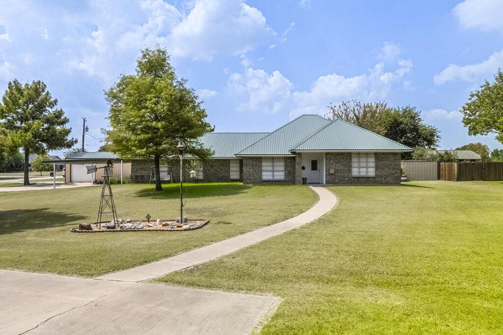 111 Kirk Road Midlothian, TX 76065 - Photo 2 of 40 a view of a house with swimming pool and a yard