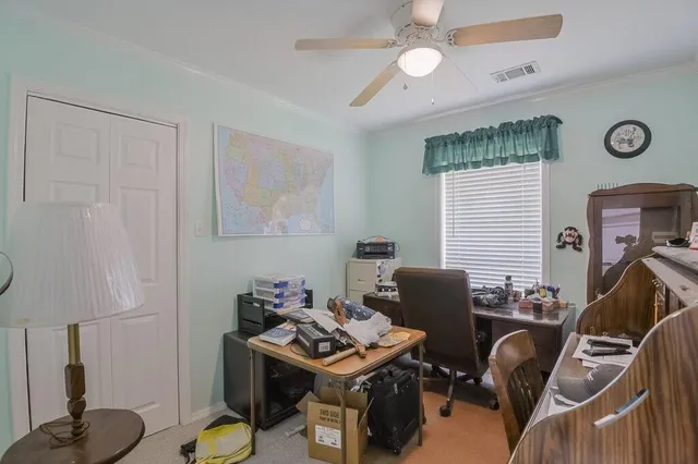 a work room with furniture and a window