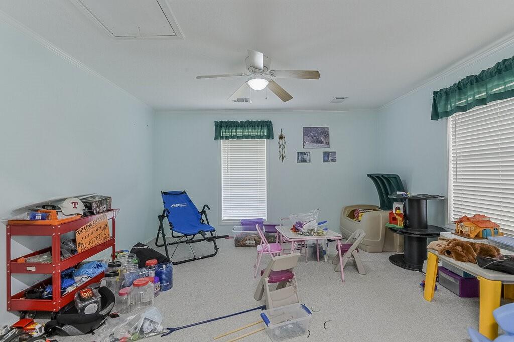 111 Kirk Road Midlothian, TX 76065 - Photo 24 of 40 a living room with furniture and a window