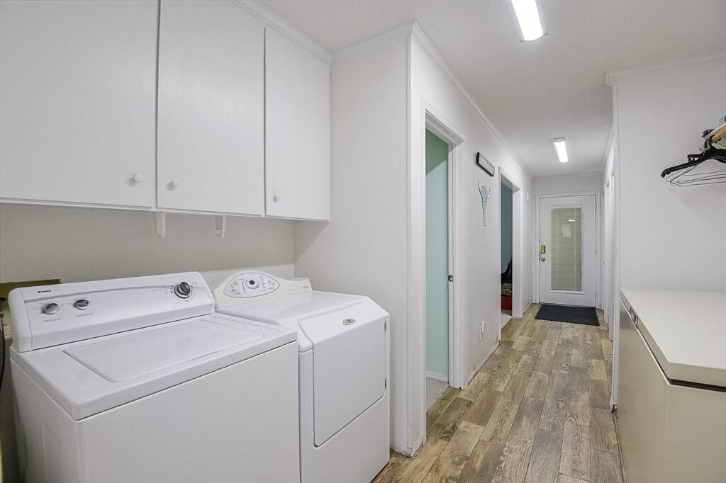 111 Kirk Road Midlothian, TX 76065 - Photo 25 of 40 a view of storage and utility room with washer and dryer