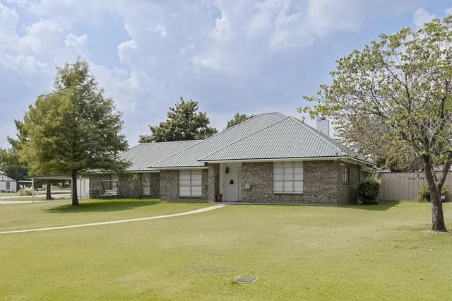 a house with trees in front of it