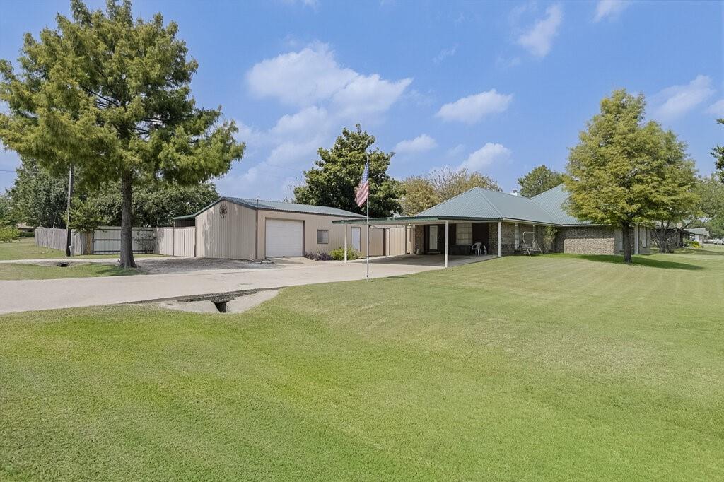 111 Kirk Road Midlothian, TX 76065 - Photo 35 of 40 a front view of a house with a garden
