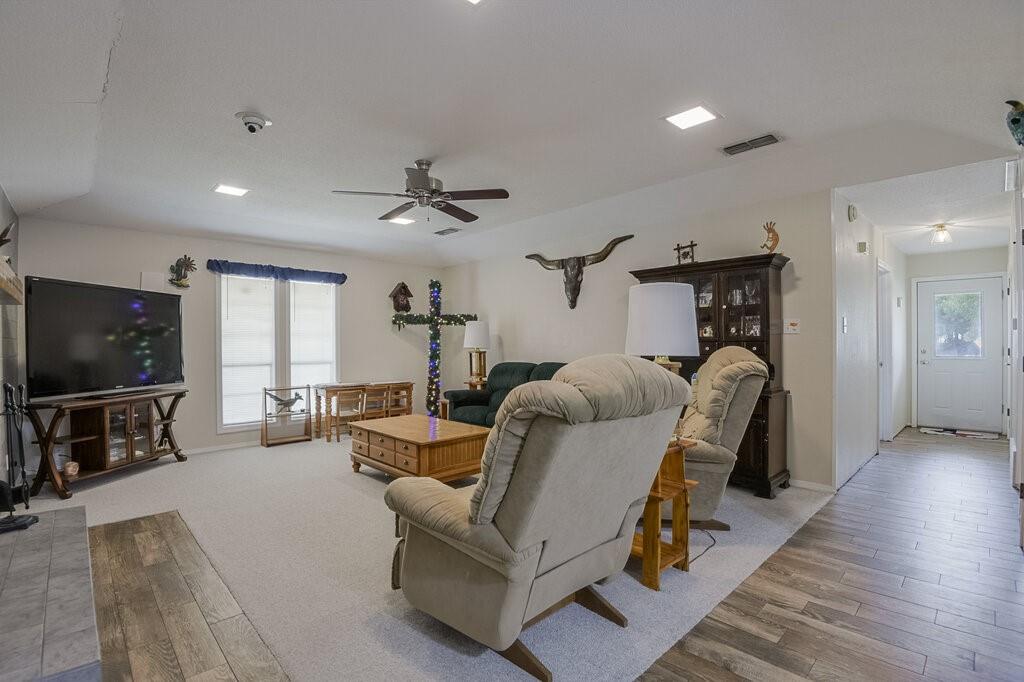 111 Kirk Road Midlothian, TX 76065 - Photo 5 of 40 a living room with furniture and a flat screen tv