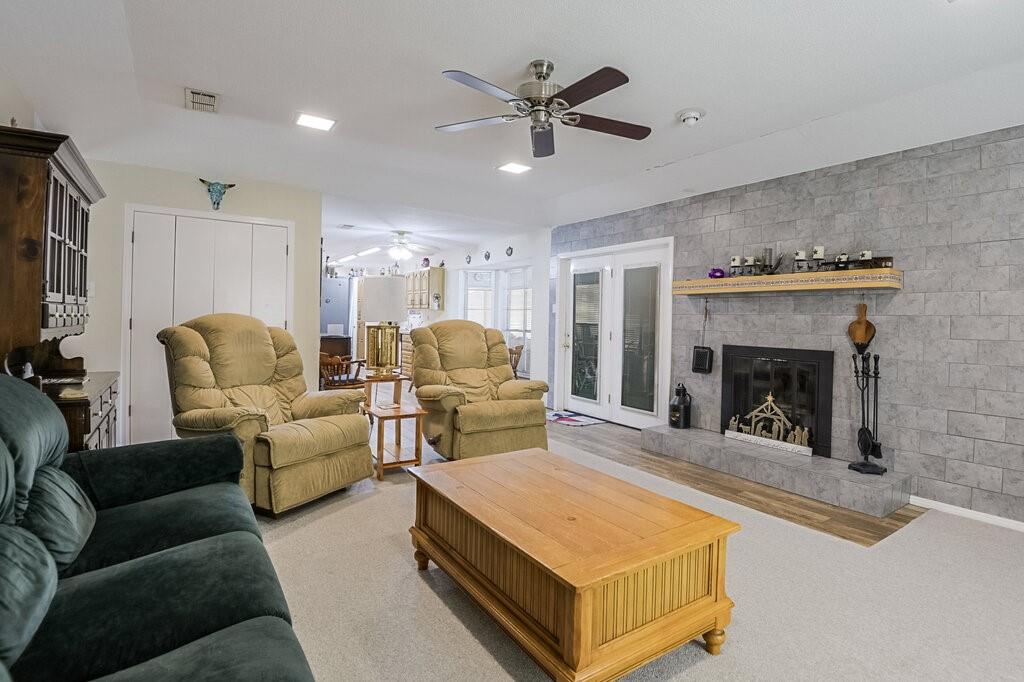 111 Kirk Road Midlothian, TX 76065 - Photo 6 of 40 a living room with furniture and a fireplace
