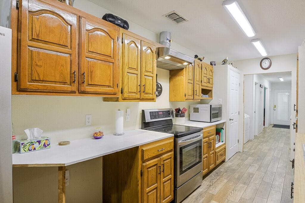 111 Kirk Road Midlothian, TX 76065 - Photo 9 of 40 a kitchen with a sink a stove and cabinets