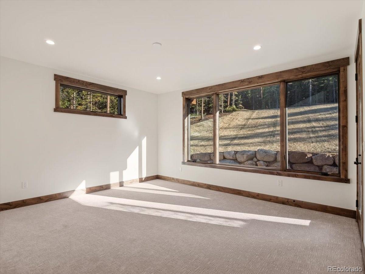 528 Fuller Placer Road Breckenridge, CO 80424 - Photo 11 of 30 a view of a big room with wooden floor and windows