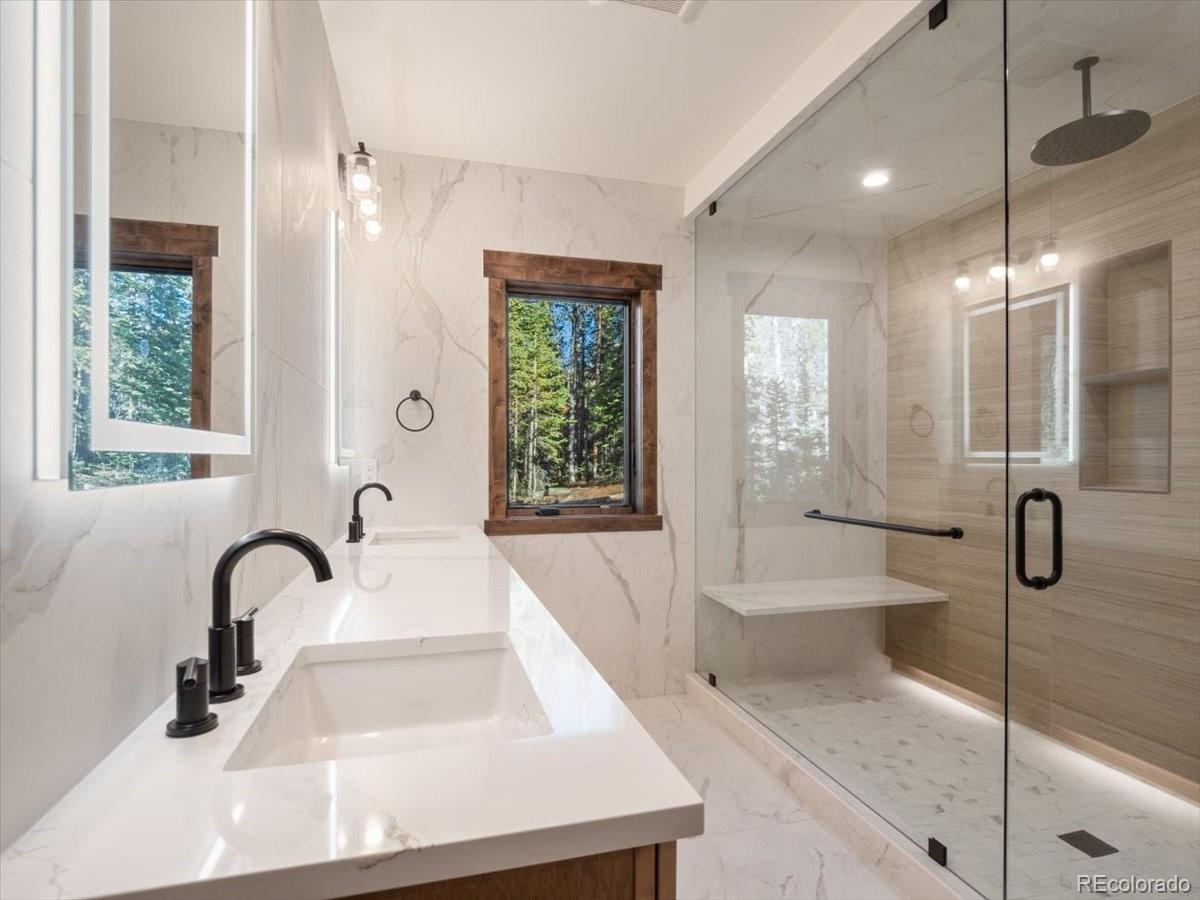 528 Fuller Placer Road Breckenridge, CO 80424 - Photo 14 of 30 a bathroom with a sink and a large mirror