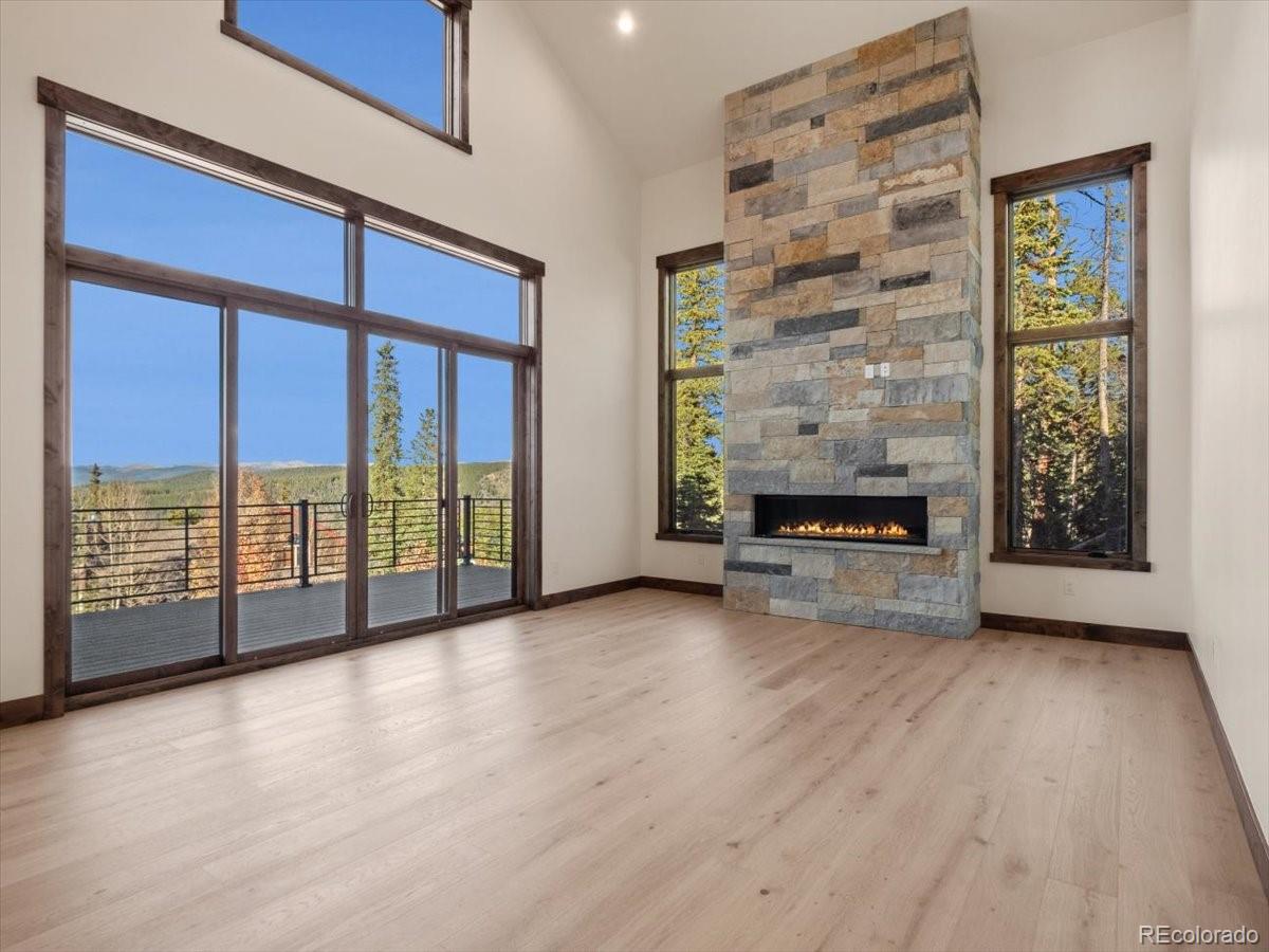 528 Fuller Placer Road Breckenridge, CO 80424 - Photo 4 of 30 a view of an empty room with a window and wooden floor