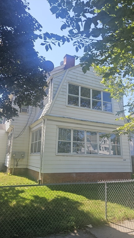 6 Eton Street Springfield, MA 01108 - Photo 3 of 26 a view of a house with a big yard