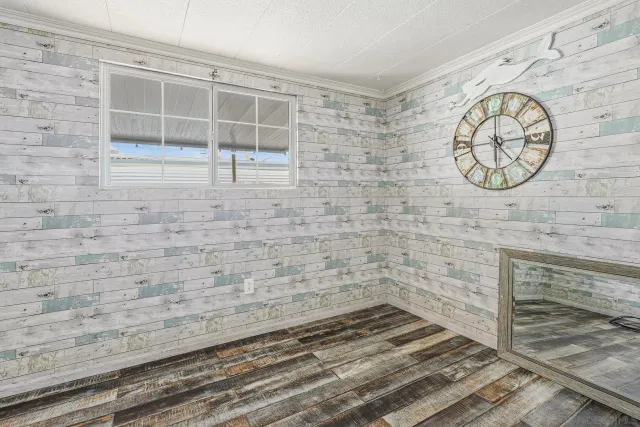 a view of wooden floor and a window