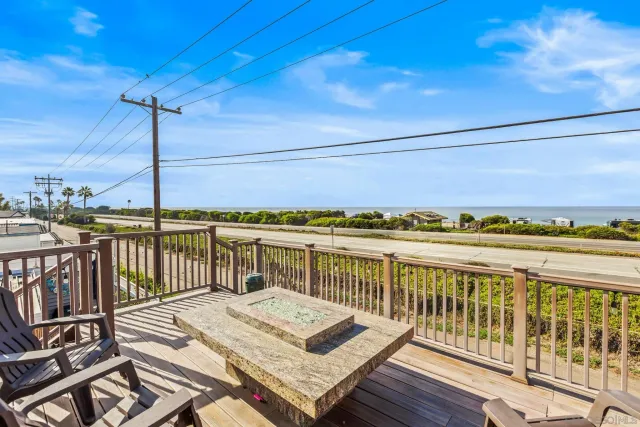a view of a balcony with wooden floor