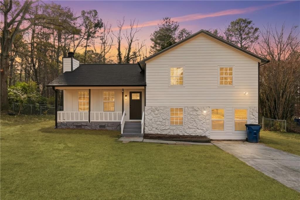 a front view of a house with a yard