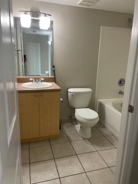 520 Villa Circle Boynton Beach, FL 33435 - Photo 5 of 8 a bathroom with a toilet sink and mirror