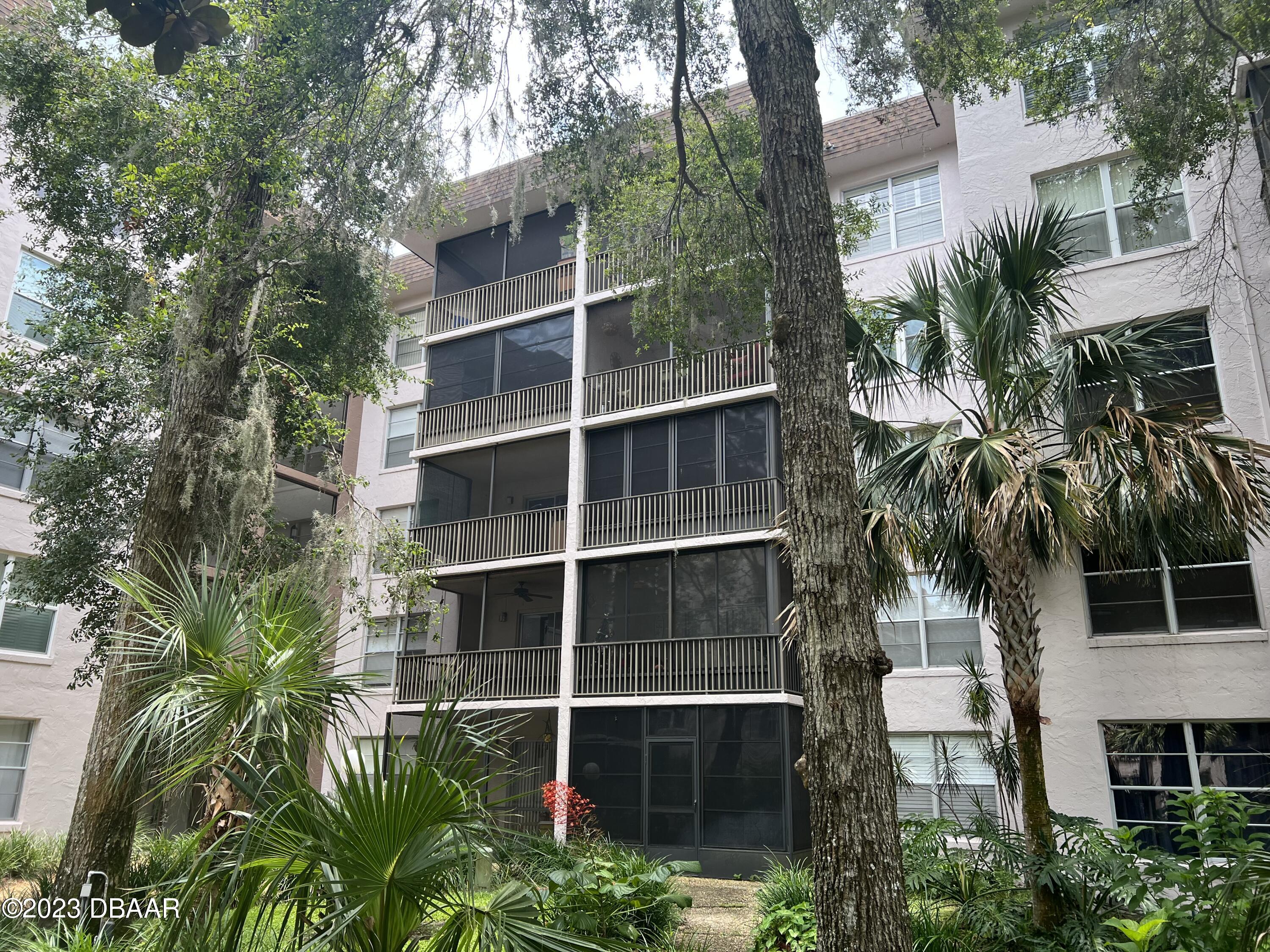 640 North Nova Road, Unit 204 Ormond Beach, FL 32174 - Photo 2 of 17 a view of a house with a yard