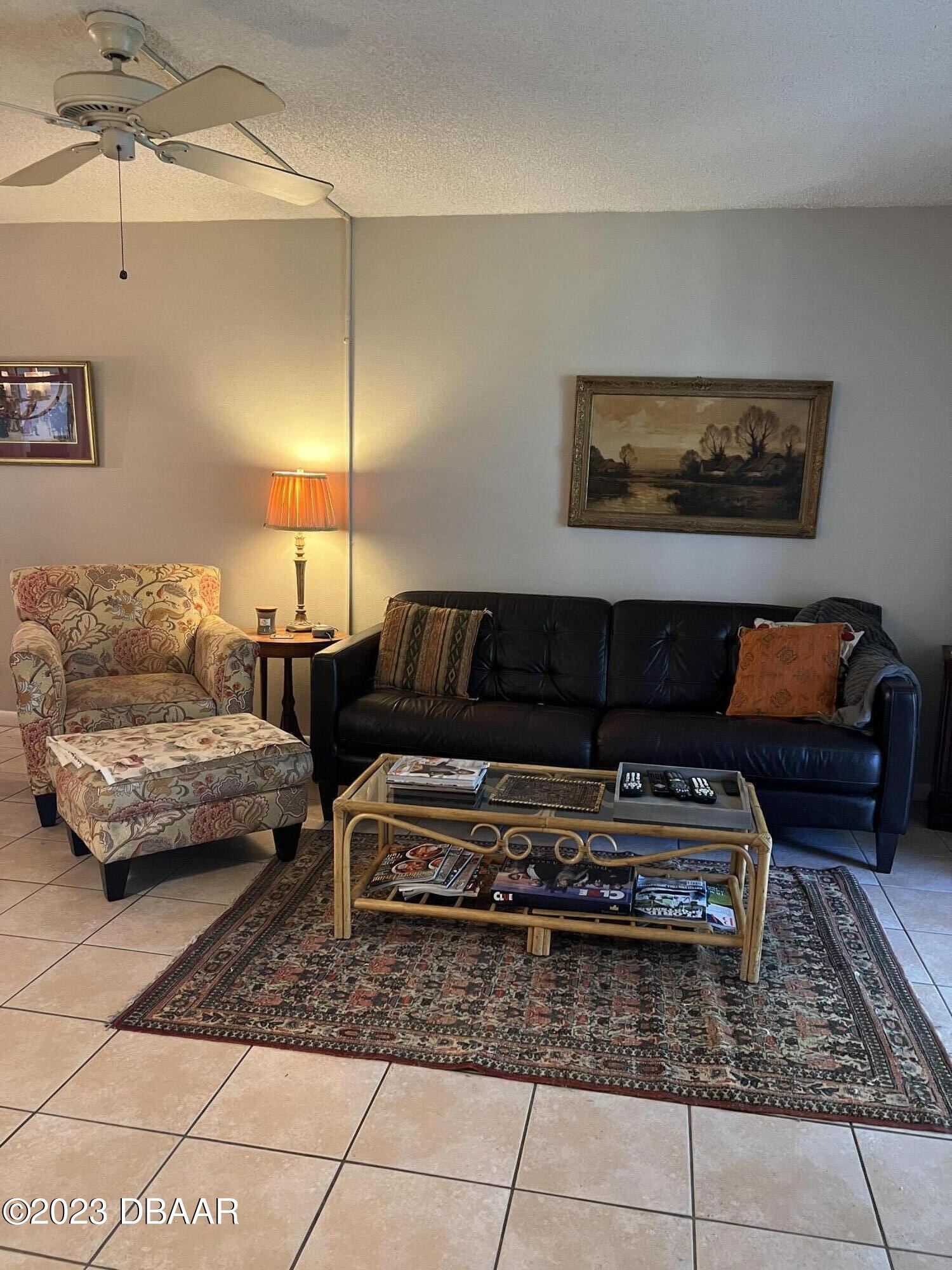 640 North Nova Road, Unit 204 Ormond Beach, FL 32174 - Photo 9 of 17 a living room with furniture and a couch