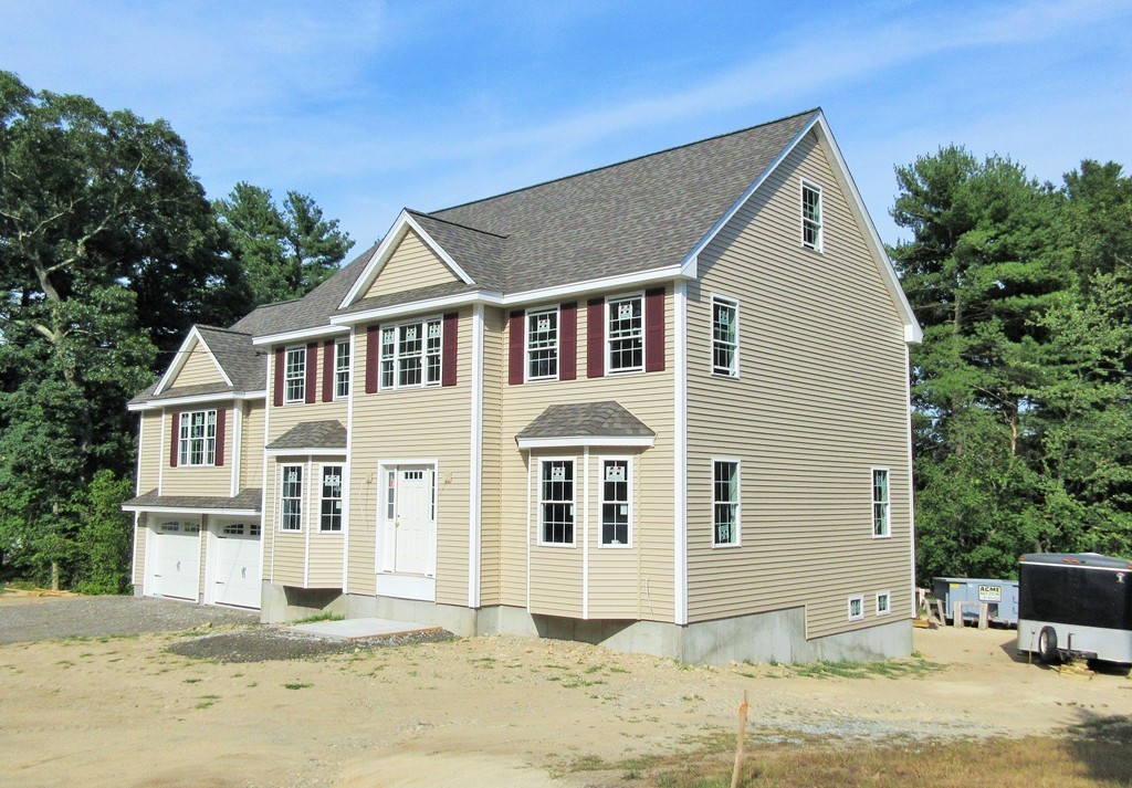 2 Tremlett Road Billerica, MA 01821 - Photo 3 of 7 a front view of a house with a yard