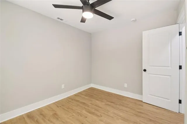 a bathroom with a sink a toilet and window