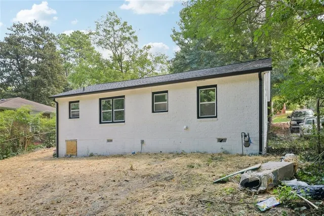 a view of a house with a tree
