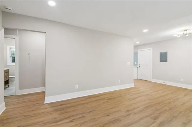 a kitchen with cabinets stainless steel appliances a sink and a stove